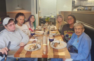Sister Gabe having brunch with our Residence Team.